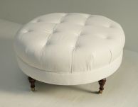 White Denim Tufted Ottoman with Turned Legs and Casters